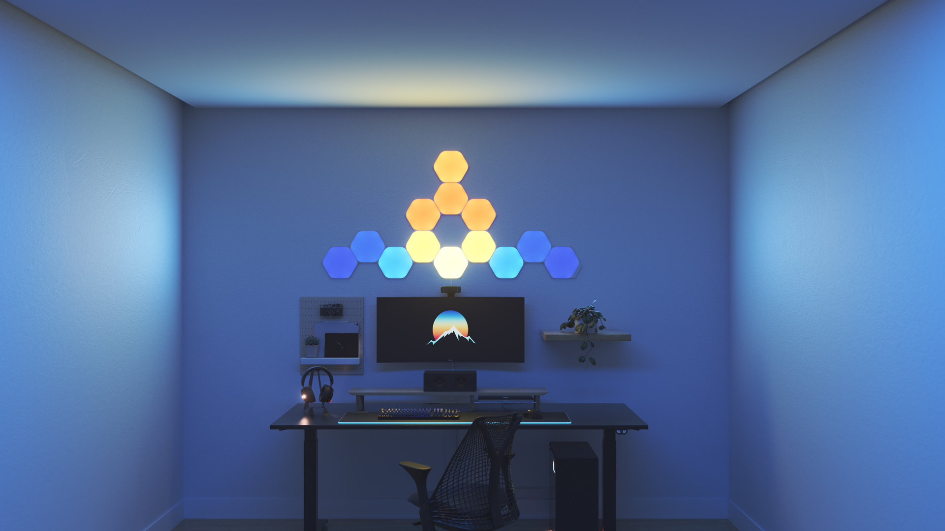 Kawaii style gaming setup with Nanoleaf Shapes Hexagon smart home RGB light panels above the PC monitor. The perfect smart lights to complete the gamer aesthetic.